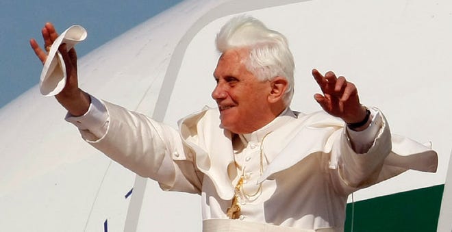 Pope Benedict XVI walks from the plane as he arrives at Andrews Air Force Base today.