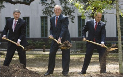 President Bush was flanked by Prime Minister Stephen Harper of Canada and President Felipe Calderón of Mexico as they planted an oak tree in New Orleans after two days of meetings.