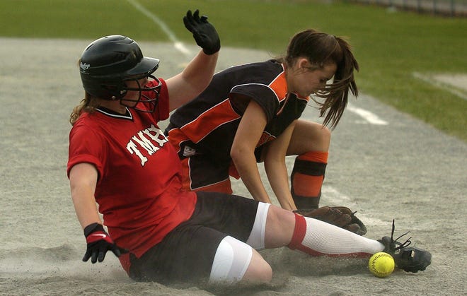 Plainfield pitcher Rachel Mandeville, right, tags out Tourtellotte's Stacey Fitch, left, at home in a game at Tourtellotte Memorial High School in Thompson on Friday, April 25, 2008.