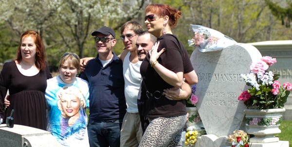 Members of the Jayne Mansfield Fan Club gather at the gravesite of the late actress in Fairview Cemetery on April 19. Mansfield would have been 75 on that date.
