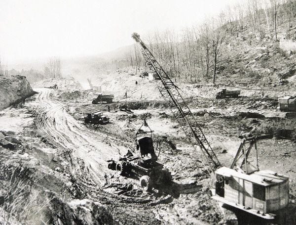 ** ADVANCE FOR SUNDAY, APRIL 27 ** This historic 1930s photograph provided by the Quabbin Visitor Center shows heavy machinery preparing the ground for the Quabbin Reservoir, in Belchertown, Mass. At 12:01 a.m. on April 28, 1938, four valley towns in western Massachusetts became non-places, their main streets and family farms soon to become the silty bottom of the massive Quabbin reservoir. (AP Photo/Quabbin Visitor Center) ** NO SALES **