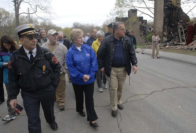 Norwich Fire Chief Kenneth Scandariato, left, tours the Peachtree fire scene
with Gov. M Jodi Rell, center and Norwich Police Chief Louis Fusaro.