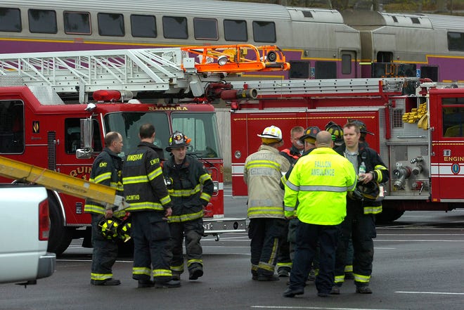Hingham firefighters and police and emergency crews from surrounding towns stage a mock disaster: a collision of a Greenbush train, a school bus and a car at the Water Street railroad crossing.