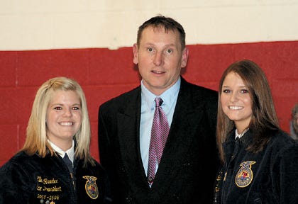 United FFA adviser Brian Cirks is pictured with club members Ellen Reeder, left, and Nicole Yung. Yung is the recipient of the 2008 DeKalb Agricultural Accomplishment Award and a District FFA Award. Reeder received a District FFA Award.