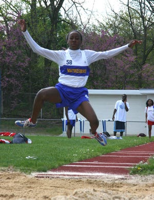 Maiden junior Katrina LaMar flies to a win in the long jump.