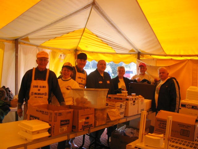 Holland Lions Club volunteers are ready serve chicken barbecue during Tulip Time in this 2005 photo.