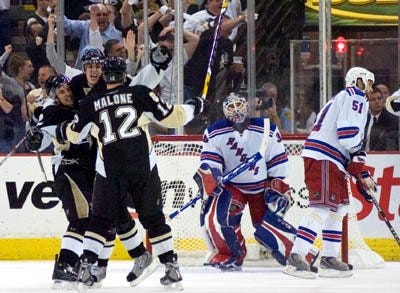 The Times/KEVIN LORENZI Sidney Crosby, Evgeni Malkin and Ryan Malone celebrate after the Penguins' first goal of game 5 of the Pens series against the New York Rangers in the Eastern Conference Semifinals.
