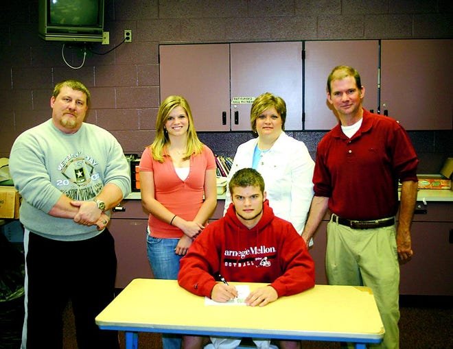 Greencastle-Antrim senior Matt Copenhaver (seated) has signed to continue his football career at Carnegie Mellon University in Pittsburgh. Accompanying Copenhaver are (back, l-r): G-A head coach Chuck Tinninis, Emily (sister) and parents Lisa and Kevin.