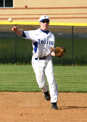 Indians shortstop Greg Wade makes the throw to first base. Wade delivered the game-winning hit in the 10th inning.