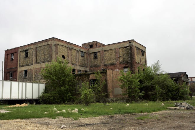 Broken windows and overgrown shrubs make the Canadian Railroad building at 700 S. Main Street in Rockford an eyesore.