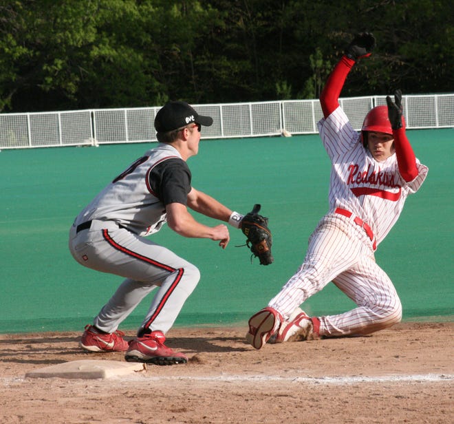 Canisteo-Greenwood's Zach Peters, right, prepares to slide into second base during Thursday's non-league game vs. B-R.