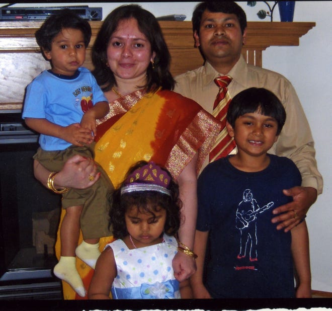 Afzel “Raj” Troast stands with his family. Clockwise from Raj are Luke, 6, Faith, 4, Jaden, 2, and Juliet.