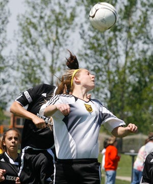 DeKalb's Tara Rossdeutcher(left) and Hononegah forward Kate Young battle for a header early in the second half Saturday, May 17, 2008, in DeKalb.