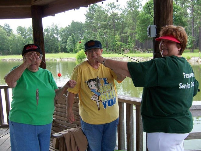 From left: Geraldine Peoples, Betty Powell and Senior Citizen Manager Kathy Sauls show off their catch at the Floyd pond in Pembroke. Diane Stewart/Bryan County Now
