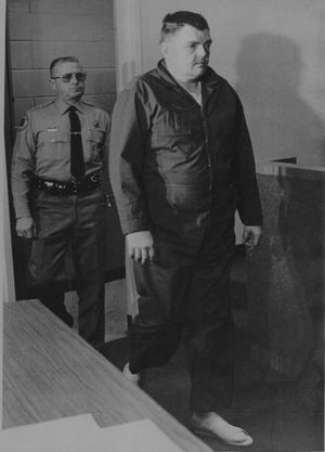 Simon Peter Nelson walks to a hearing in Rockford on Monday, Jan. 9, 1978. Nelson, charged with the murders of his six children, did not enter a plea at the hearing.