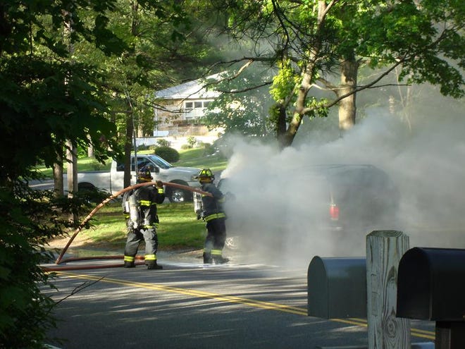 Hanover firefighters put out an SUV fire on Center Street. J. Robbs, who took this photo, said the flames were out in less than a minute.