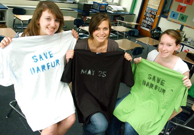 -Three Scituate High juniors organized a fundraiser for Darfur. On their own they enlisted a popular local band to play. Sydney O'Connell, Kristine Downing, and Colleen Farragher.