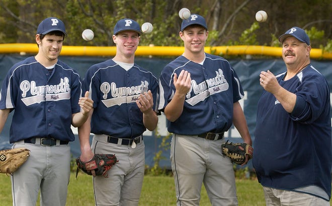 The Big Three of Plymouth North baseball – Evan Martinsen, Tom MacInnes and Joe Flynn – pose with coach Dwayne Follette during a recent practice.