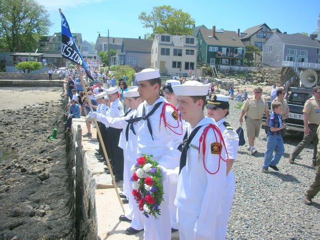 US Naval Sea Cadets, Boston Minuteman Division, stand at attention at Lumber Wharf.