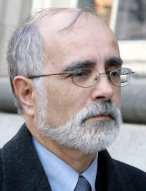 In this file photo taken Jan. 30, 2007, Carlos Ortiz, former CVS vice president of government affairs, leaves federal court in Providence, R.I., following his arraignment on conspiracy and bribery charges. A jury deliberated for less than two hours before finding Ortiz and John R. Kramer not guilty of 23 counts of bribery, mail fraud and conspiracy on Friday, May 30, 2008.