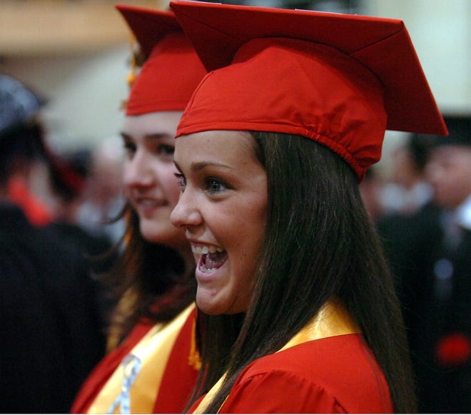 Katelyn Arouca is all smiles during graduation exercises on Friday at Whitman-Hanson Regional High School.
