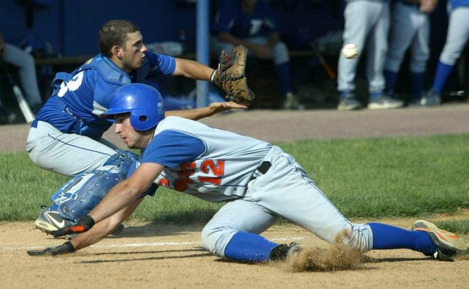 S.S. Seward’s Fred Salamone dives for home plate as Millbrook catcher Evan Halvorsen takes the throw during the Section 9 Class C championship game at SUNY New Paltz on June 2, 2008.