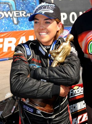 Hillary Will hugs her trophy after winning Top Fuel at the 20th annual O'Reilly NHRA Summer Nationals at Heartland Park Topeka in Topeka, Kan. on Sunday, June 1