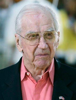 Ed McMahon arrives at the premiere of The Simpsons Movie in Los Angeles, in this July 24, 2007 file photo. McMahon, who for decades appeared as Johnny Carson's sidekick on "The Tonight Show," is fighting to avoid foreclosure on his multimillion-dollar Beverly Hills home, according to published reports.