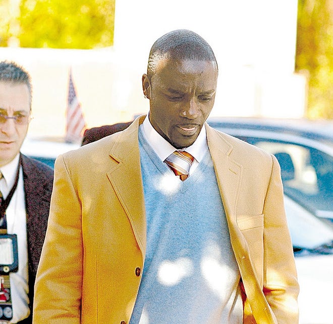 Aliaune Damala Thiam, or Akon, walks out of Fishkill Town Court in December.