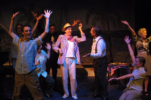 Peter Earle, left, wearing hat, and Peter Milsky appear with the ensemble in the Academy of Performing Arts’ “La Cage aux Folles.”