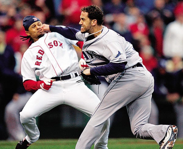 Tampa Bay Rays pitcher James Shields, right, takes a swing at Boston Red Sox's Coco Crisp after Crisp was hit by a pitch and charged the mound in the second inning of a baseball game, Thursday, June 5, 2008, in Boston. (AP Photo/Michael Dwyer)