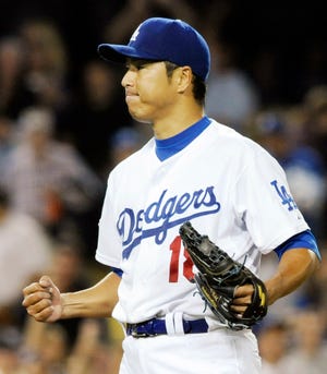 Los Angeles Dodgers starting pitcher Hiroki Kuroda celebrates after getting the last out of a complete game shutout in a Major League Baseball game against the Chicago Cubs in Los Angeles, Friday, June 6, 2008.