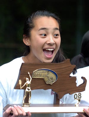 Algonquin's Stephanie Hom is all smiles after the Tomahawks won the Div. 1 Central title yesterday.
