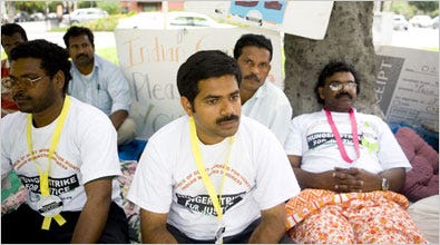 Reji Davis, center, and other workers from India on a hunger strike on Embassy Row in Washington. They say they were promised permanent residency.