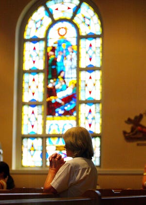 Geri Cummings of Brockton attends the 110th anniversary Mass at St. Casimir Church in Brockton on Sunday.