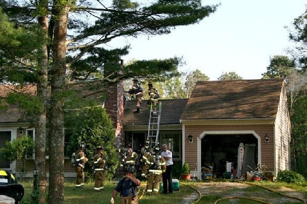 Mashpee firefighters believe a gas grill fire on the deck spread to the kitchen, breezeway and attic at 203 James Circle.