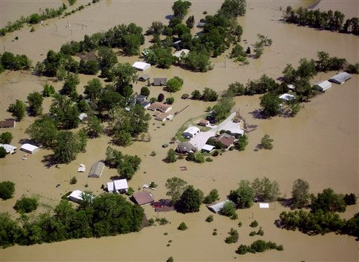 An aerial view shows homes flooded near Lawrenceville, Ill., after a levee break along the Wabash River Tuesday, June 10, 2008, in eastern Illinois near the Indiana border.
