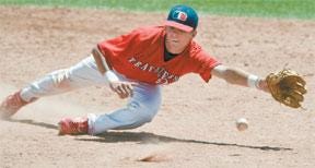 CHIEFTAIN PHOTO/MIKE SWEENEY Elk City shortstop Randy Hendry lunges for a ground ball during the Travelers' game against Hays during their first-round game at the 2008 Tony Andenucio Memorial Tournament Thursday at the Runyon Baseball Complex.