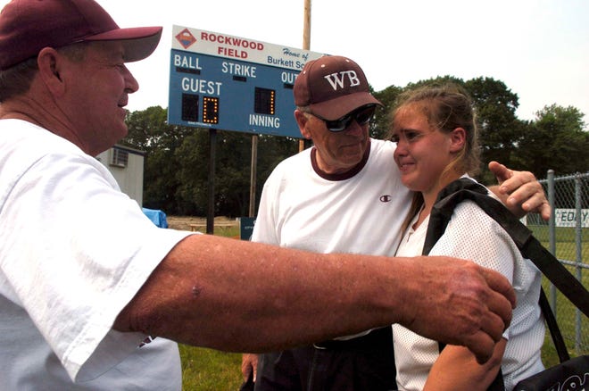 West Bridgewater coaches Ed Fitzgerald and Dick Zanca console their catcher Lauren Baker, after a 2-1 loss in 10-innings. After the game they announced that they won't be back for another year on the Wildcat bench.