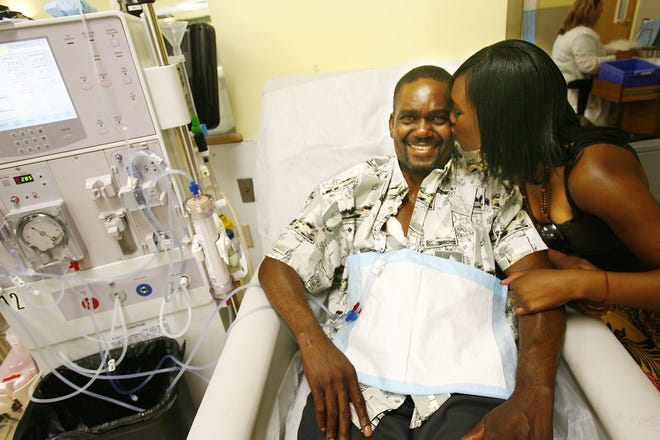 Seventeen-year-old Brockton High School senior Chiemeka Nnoli sits with her father, Ben Nnoli, at Brockton Dialysis Center, where he receives dialysis treatment three times a week. Nnoli says she is thankful for the center and their treatments which keep her father alive and has been her inspiration to pursue a medical career.