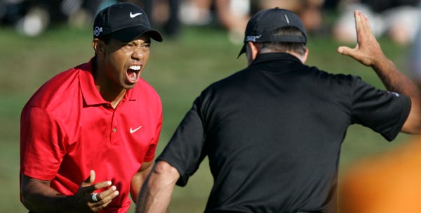 Tiger Woods celebrates with his caddie Steve Williams after sinking a birdie putt on the 18th green in the final round of the U.S. Open at Torrey Pines on Sunday. Woods will play an 18-hole playoff against Rocco Mediate to determine the winner today.