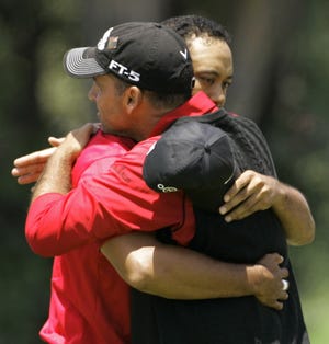 Tiger Woods (rear) and Rocco Mediate embrace at the end of the U.S. Open.