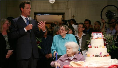 Del Martin, seated, and Phyllis Lyon were the first same-sex couple in San Francisco to exchange wedding vows on Monday. Mayor Gavin Newsom, left, presided.