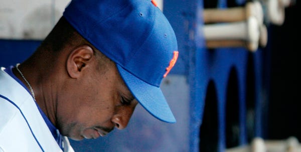 In this May 26, 2008 file photo, New York Mets manager Willie Randolph sits in the dugout before the start of the game against the Florida Marlins at Shea Stadium in New York. After weeks of speculation that his job was in jeopardy, Willie Randolph finally got fired by the New York Mets early Tuesday June 17, while most fans were sleeping.