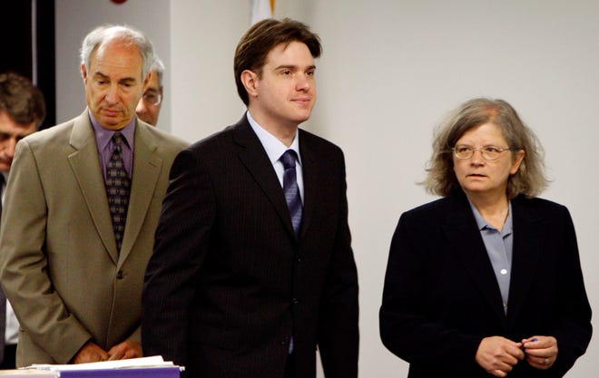 Neil Entwistle, center, defense attorneys Stephanie Page, right, and Elliot Weinstein return from a sidebar meeting during Entwistle's murder trial on Wednesday. He is charged with first-degree murder in the death of his wife, Rachel, and infant daughter, Lillian, in their Hopkinton home in January 2006.