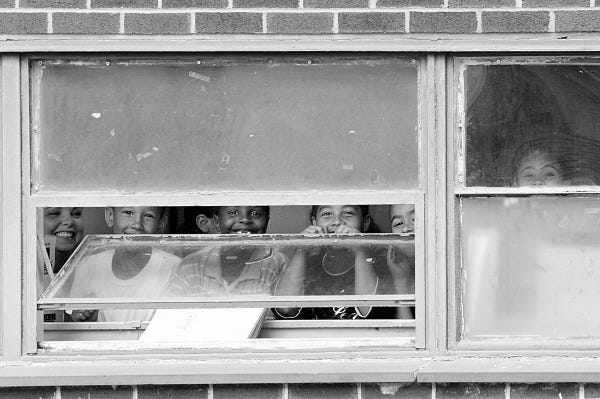 2008/06/17 14:42:49 peter_in / mural campbell school / _M5Y3832
PETER PEREIRA/The Standard Times

++ Yougsters peek out of their classroom window in anticipation for the Art Works Teen mural unveiling today at the Campell elementary school in the north end of New Bedford.