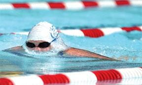 CHIEFTAIN PHOTO/FILE Madison Krall, then 14, competes in the 200-meter long course breaststroke at the Mineral Palace Park pool for the Pueblo Swim Club in 2004.