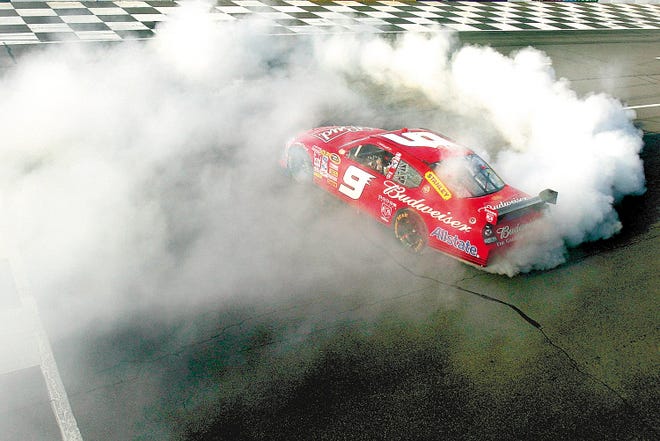 Kasey Kahne, driver of the No. 9 Budweiser Dodge, does a burnout to celebrate his win after the NASCAR Sprint Cup Series Pocono 500 on June 8 at Pocono International Raceway.