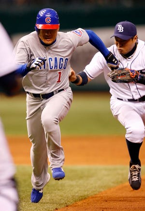 Chicago Cubs’ Kosuke Fukudome, left, is caught in a rundown while trying to steal second base by Tampa Bay Rays second baseman Akinori Iwamura during the third inning Thursday in St. Petersburg, Fla.