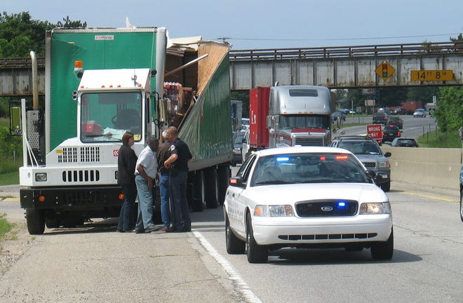 A 7Up truck carrying cases of the soft drink struck the railroad bridge over U.S. 31 between 32nd Street and Lincoln Avenue Friday morning, June 20. Less than an hour earlier, a man driving a truck with a car hauler also struck the same overpass, Holland police said.